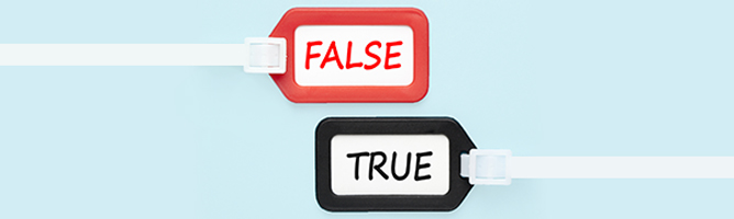 True or false written on luggage tags on blue background.