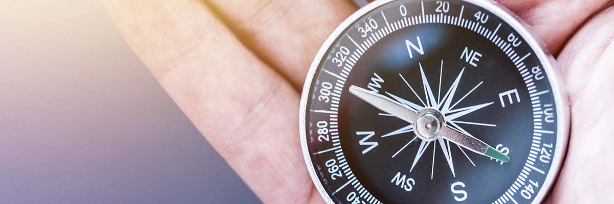 a compass in the palm of a hand